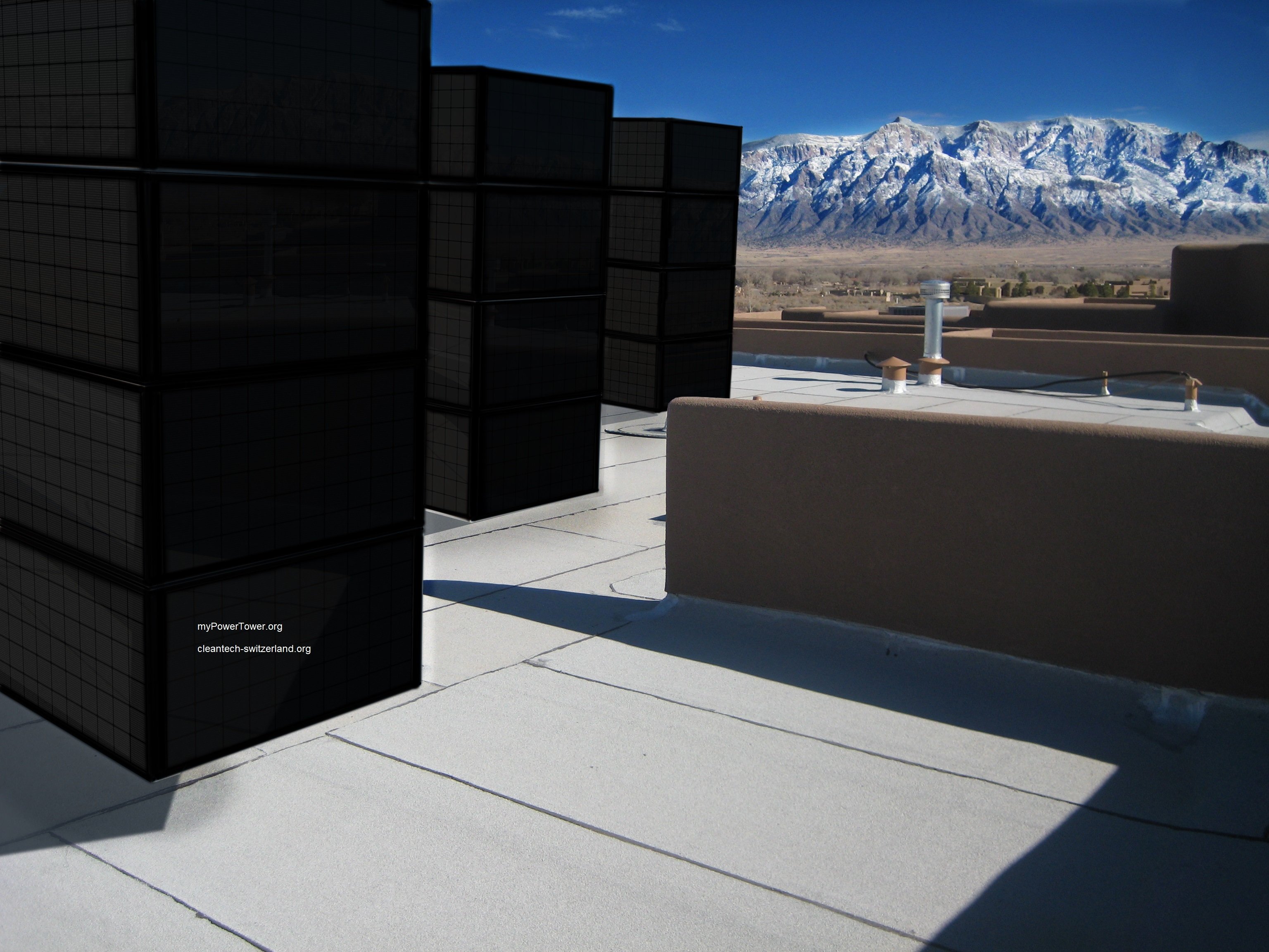 myPowerTower.org by cleantech-shop.org some on the roof of a building with black solarpannels