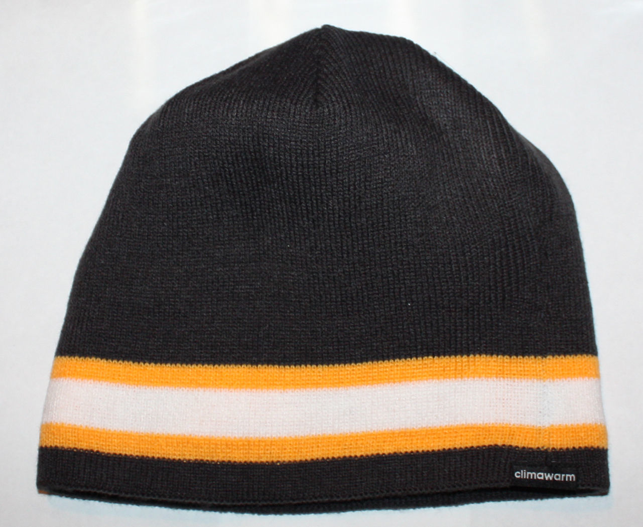 reversible to charcoal gray with thick white and mustard yellow stripe