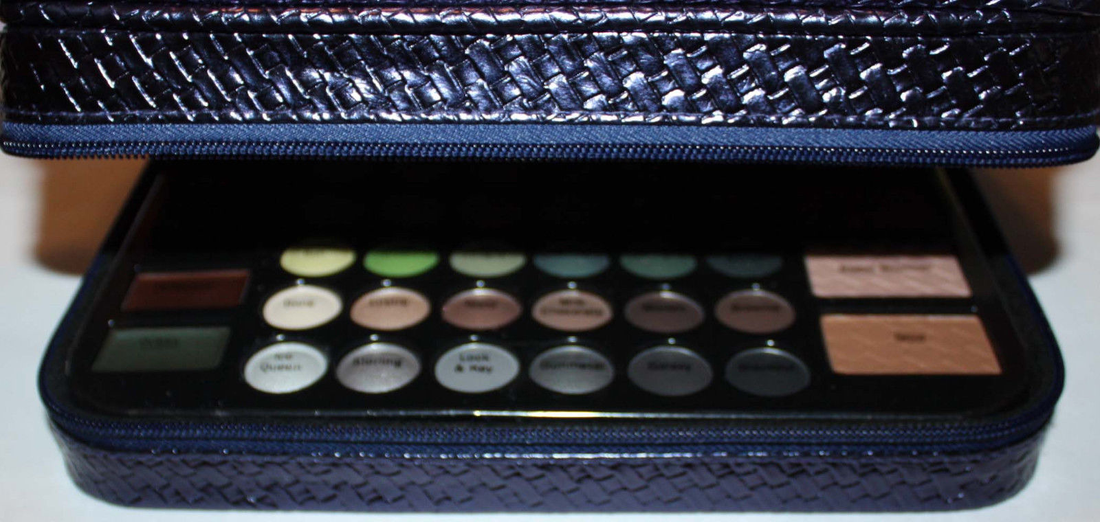 makeup palette inside lower zippered compartment