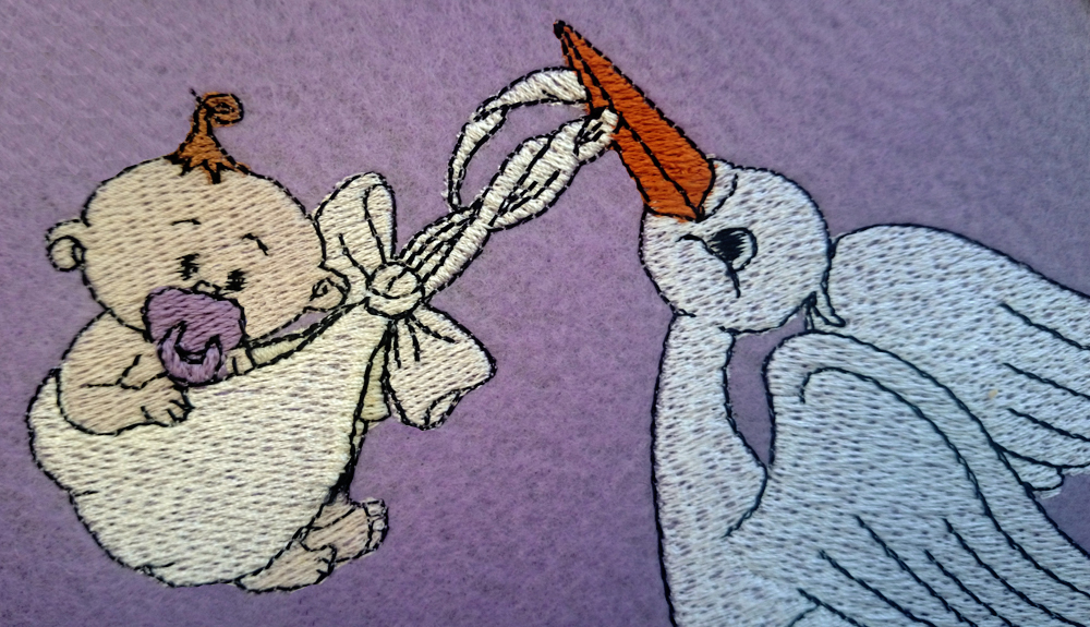 Machine Embroidery Designs A stork delivering a newborn baby girl & boy