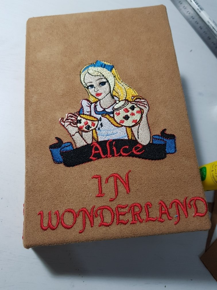 Machine Embroidery Design Alice pours a cup of tea from the kettle - 2 sizes