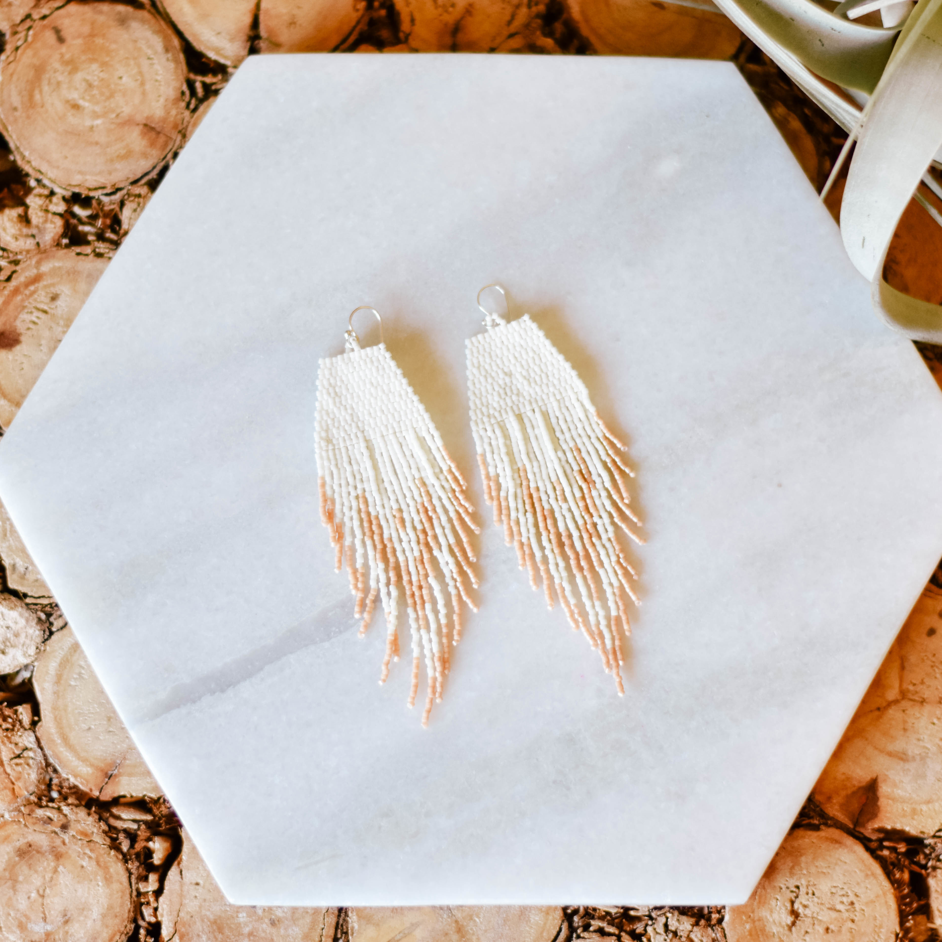 feather fringe earrings in peach