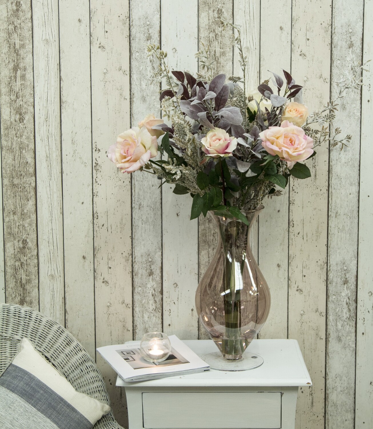 Roses And Foliage In A Copper Hourglass Vase