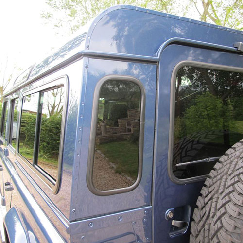 Dark-Tinted Rear Quarter Glass Windows for Land Rover Defender 90 and 110 (Oval Shape)
