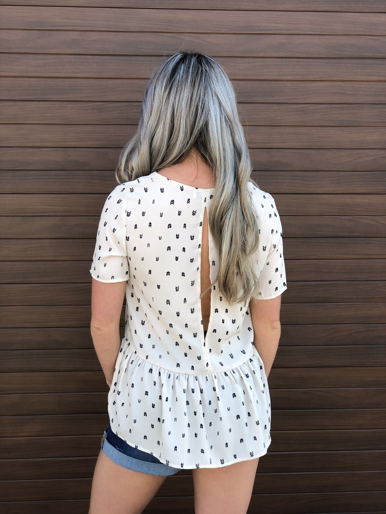 The Open Back Peplum Style Blouse