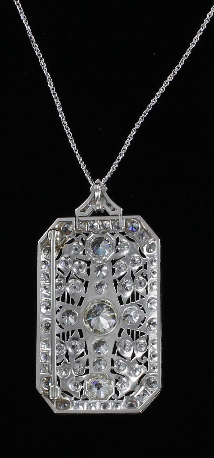 PLATINUM 7.0 CT TW DIAMOND PENDANT/PIN CIRCA 1920