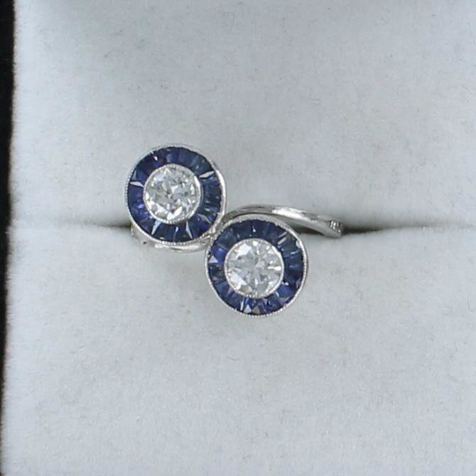 PLATINUM DIAMOND AND SAPPHIRE BYPASS RING CIRCA 1930 222-144