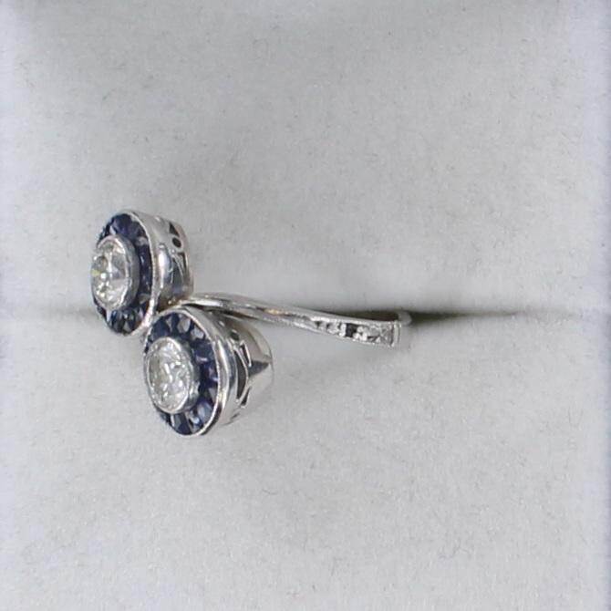 PLATINUM DIAMOND AND SAPPHIRE BYPASS RING CIRCA 1930