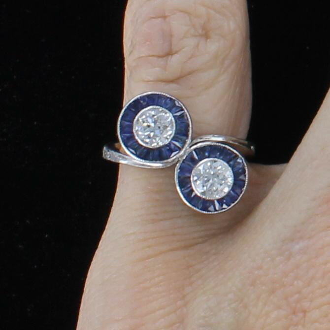 PLATINUM DIAMOND AND SAPPHIRE BYPASS RING CIRCA 1930