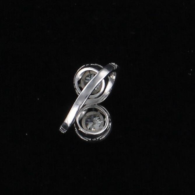 PLATINUM DIAMOND AND SAPPHIRE BYPASS RING CIRCA 1930
