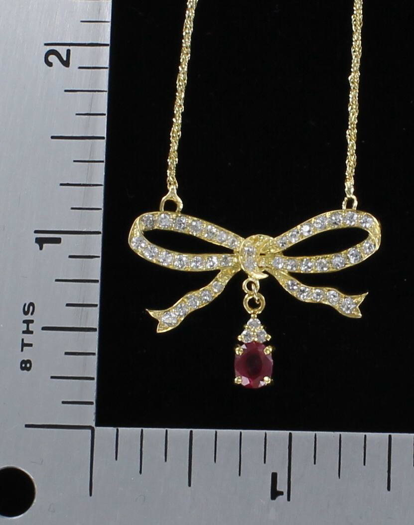 18KT DIAMOND AND RUBY BOW NECKLACE