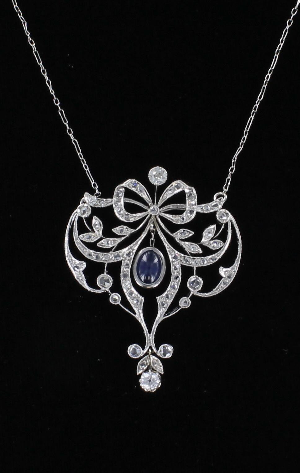 18KT SAPPHIRE AND DIAMOND BOW NECKLACE CIRCA 1920 198-23007