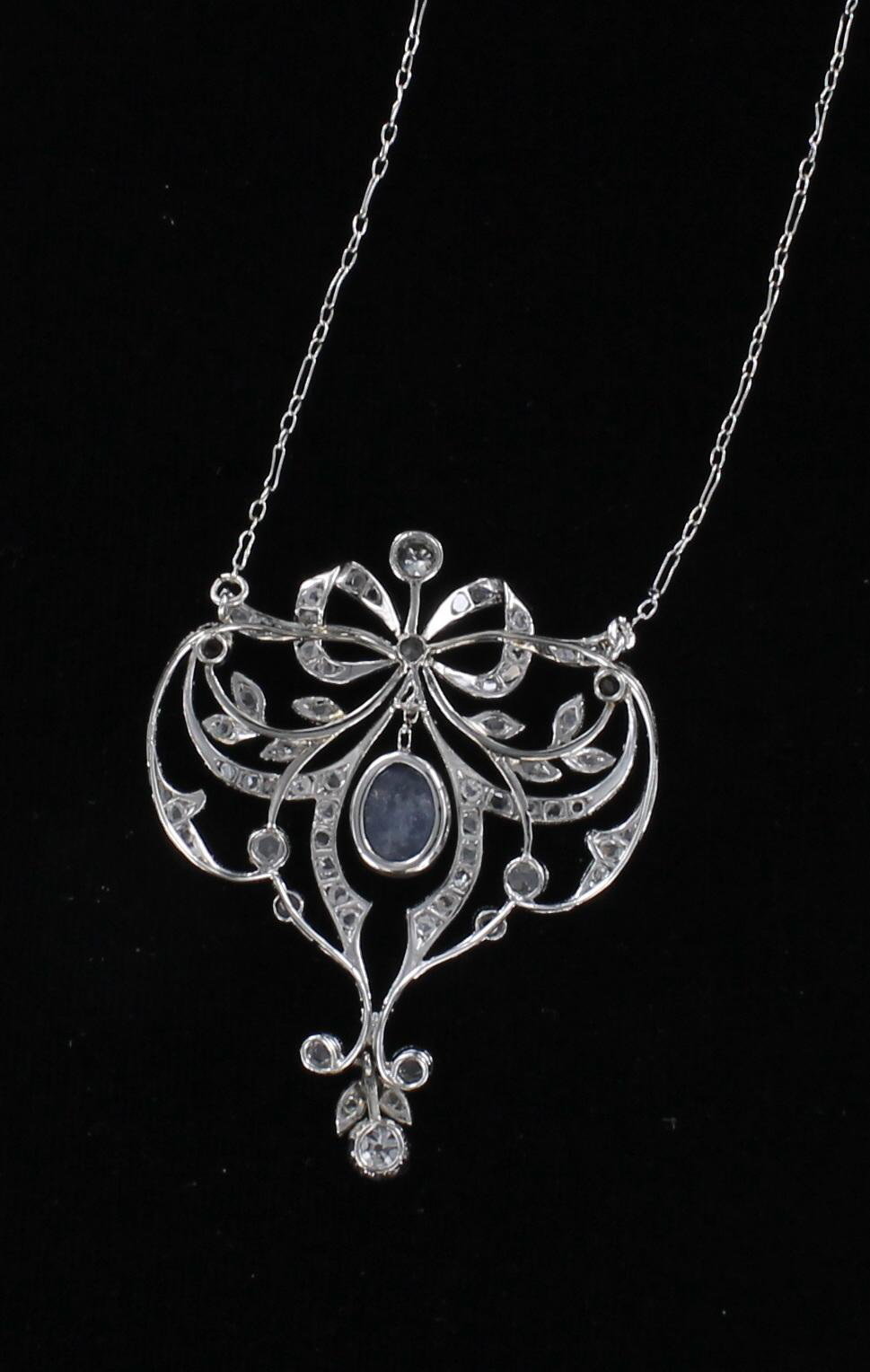 18KT SAPPHIRE AND DIAMOND BOW NECKLACE CIRCA 1920