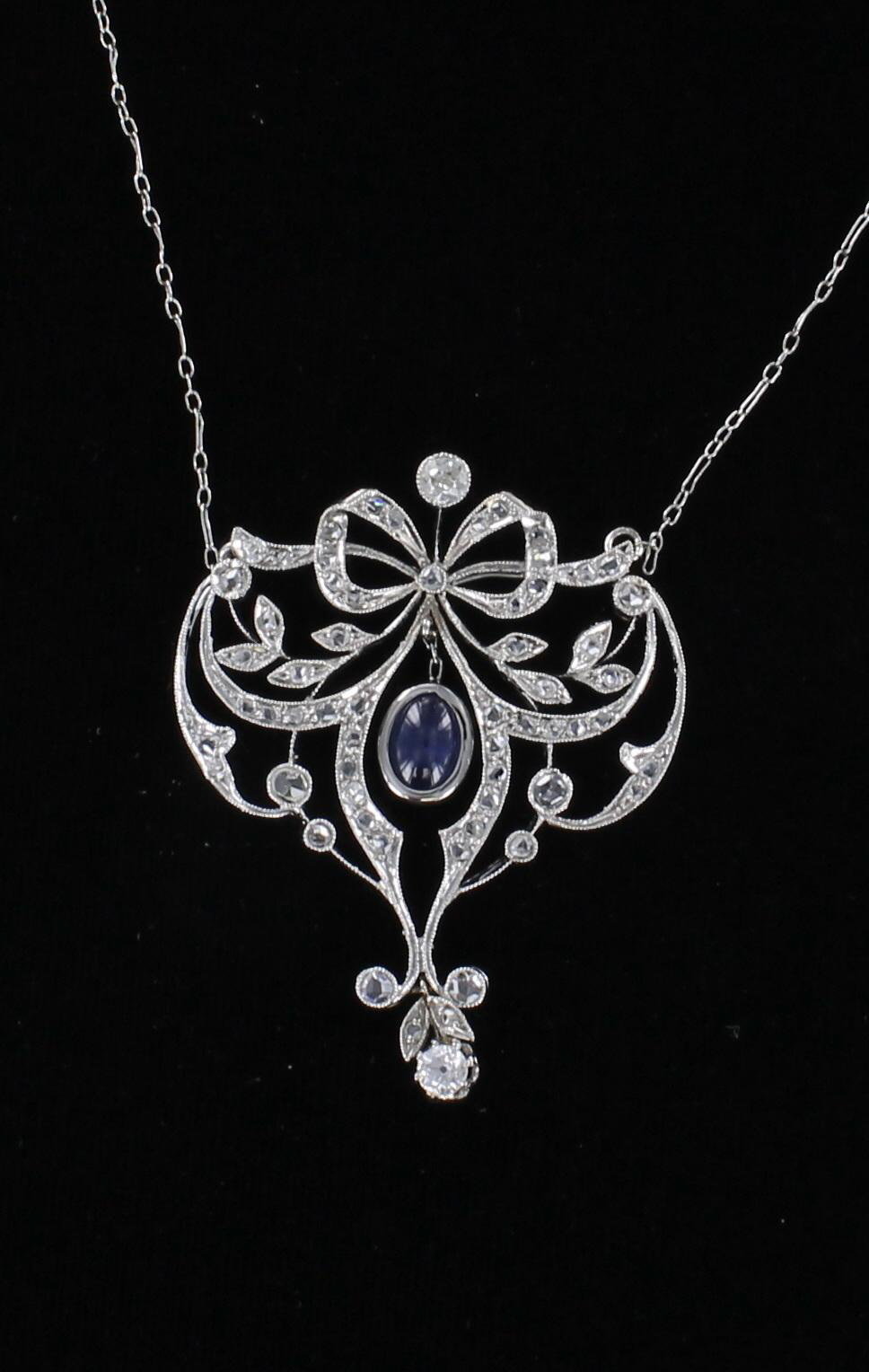 18KT SAPPHIRE AND DIAMOND BOW NECKLACE CIRCA 1920
