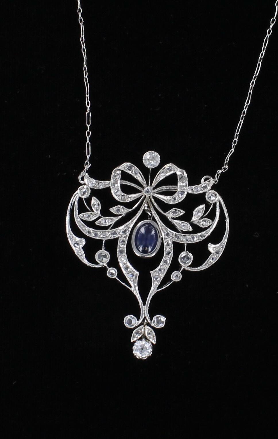 18KT SAPPHIRE AND DIAMOND BOW NECKLACE CIRCA 1920