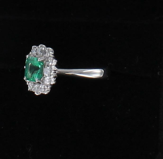 PLATINUM EMERALD AND DIAMOND RING