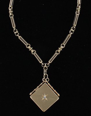 9KT LOCKET WITH WATCH CHAIN CIRCA 1900 9KT LOCKET WITH WATCH CHAIN CIRCA 1900
