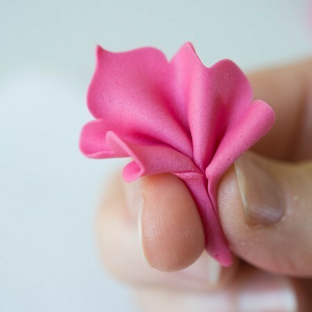 Pinching the paste to form a ruffle