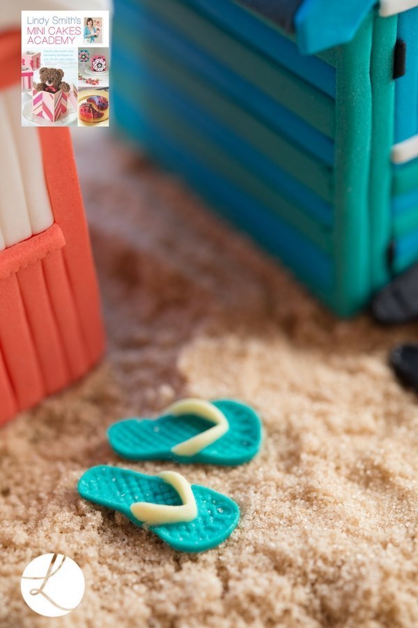 sugar flip flops help decorate and set the scene for these delightful beach hut cakes