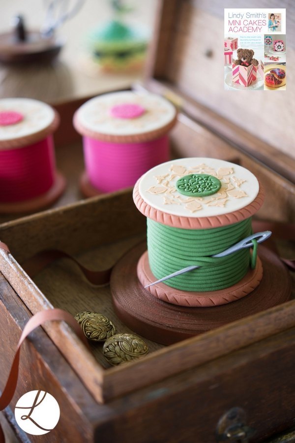 five point medallion stencil used to add the decorative self coloured patters to the top of these vintage wooden cotton reel cakes