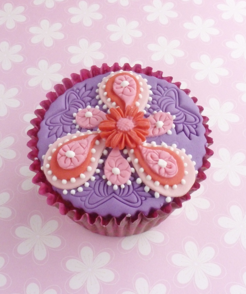 Lace motif embosser used to add texture on this paisley inspired Indian themed cupcake