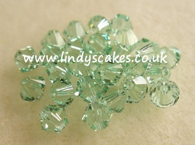 Green - pale Chrysolite Swarovski Crystals (4mm) SKU1755435