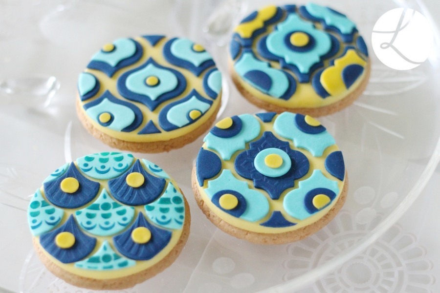 bottom right cookie is decorated using the medium arabesque sugarcraft tile cutter