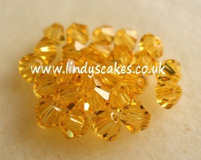 Gold - Light Topaz Swarovski Crystals (4mm) SKU1755413