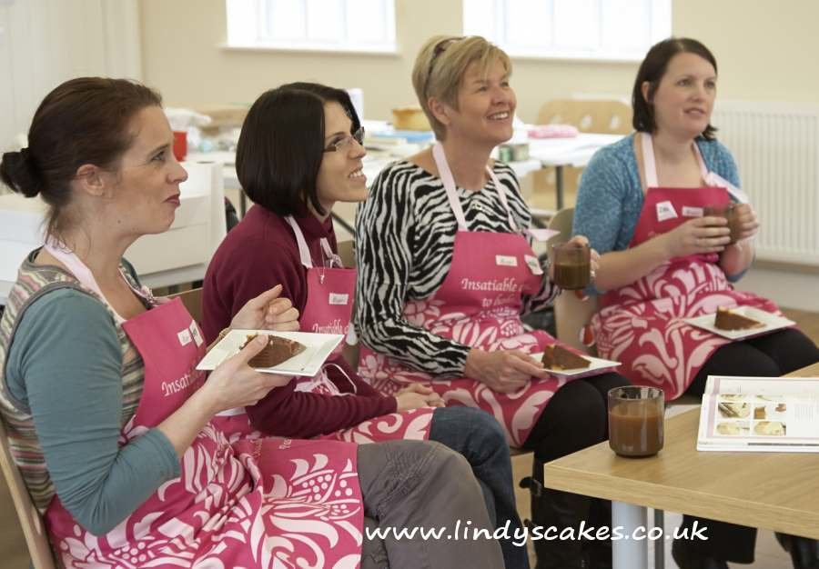 enjoying cake and chat whilst watching Lindy demo