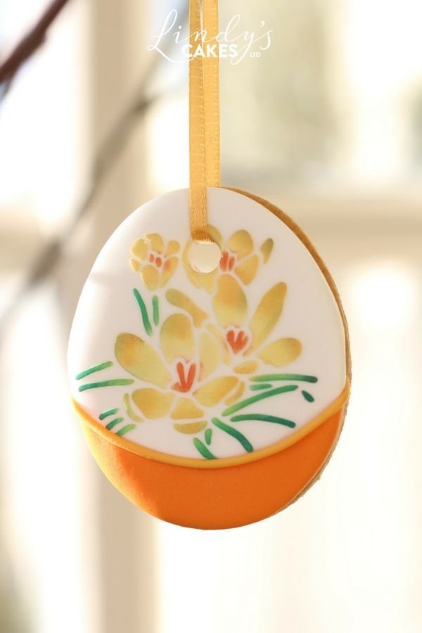 Hanging Easter eggg decorated with a crocus stencil