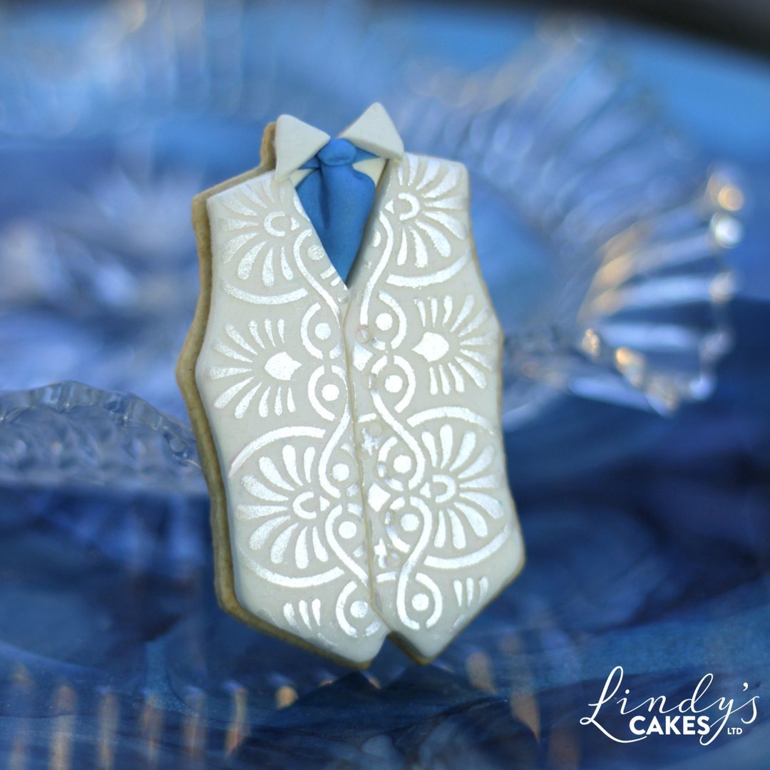 Wedding waistcoat cookie decorated with Lindy's Greek repeat stencil