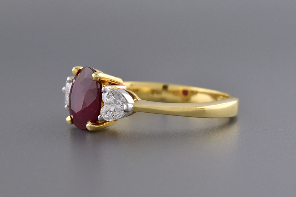 Ruby Ring with Heart Shaped Side Diamonds