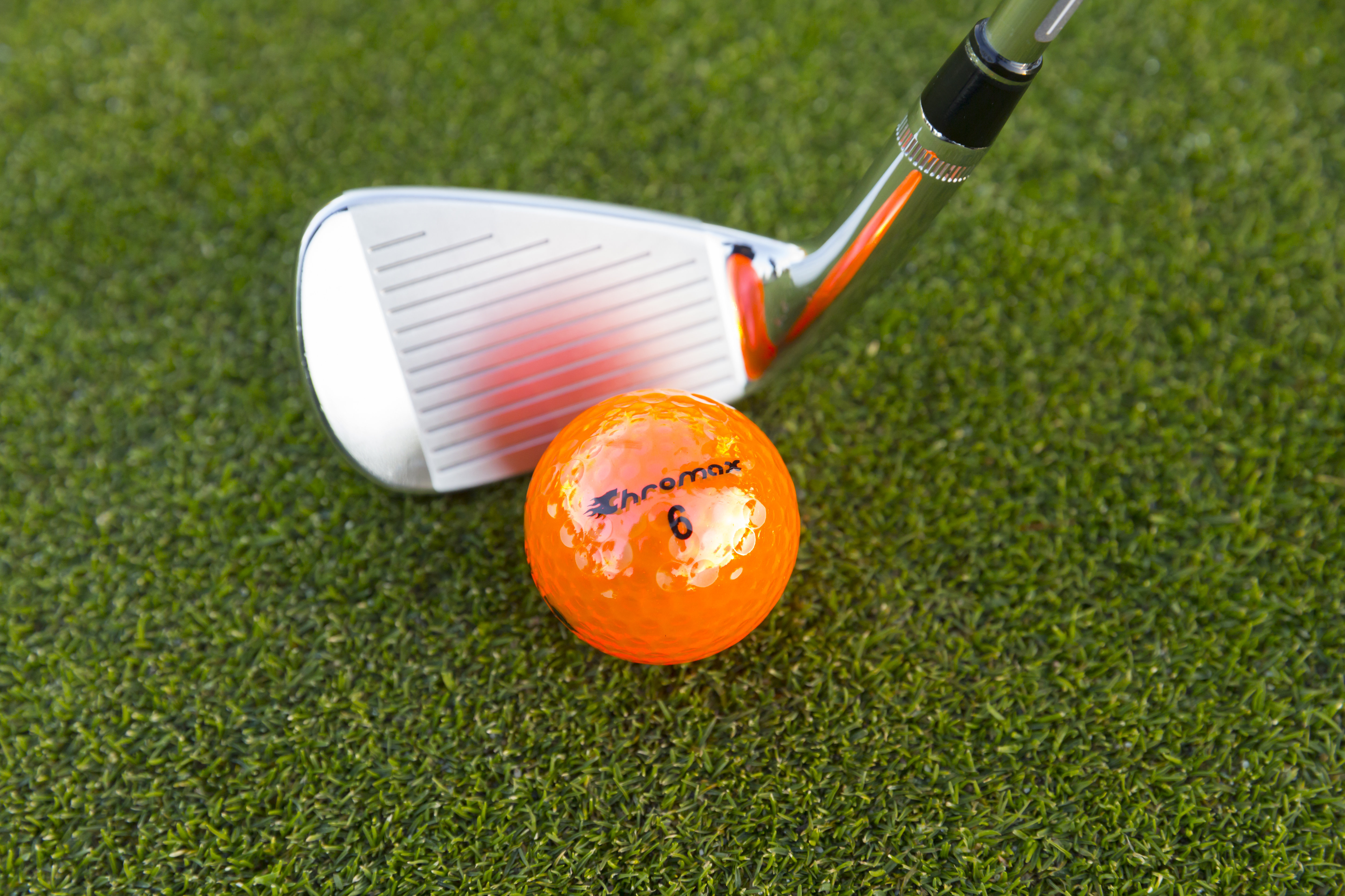 Chromax orange golf ball M5 and wedge