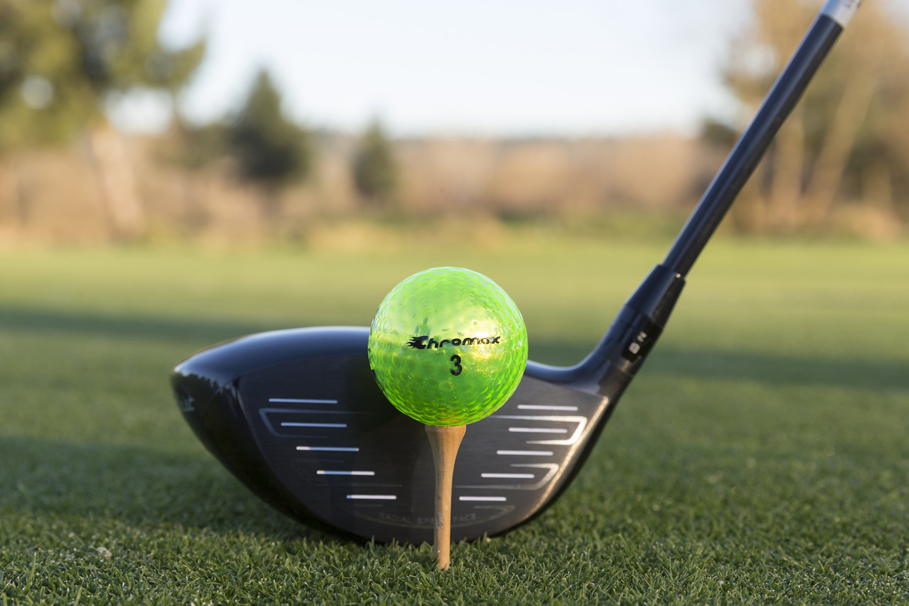 Chromax green neon golf ball with driver
