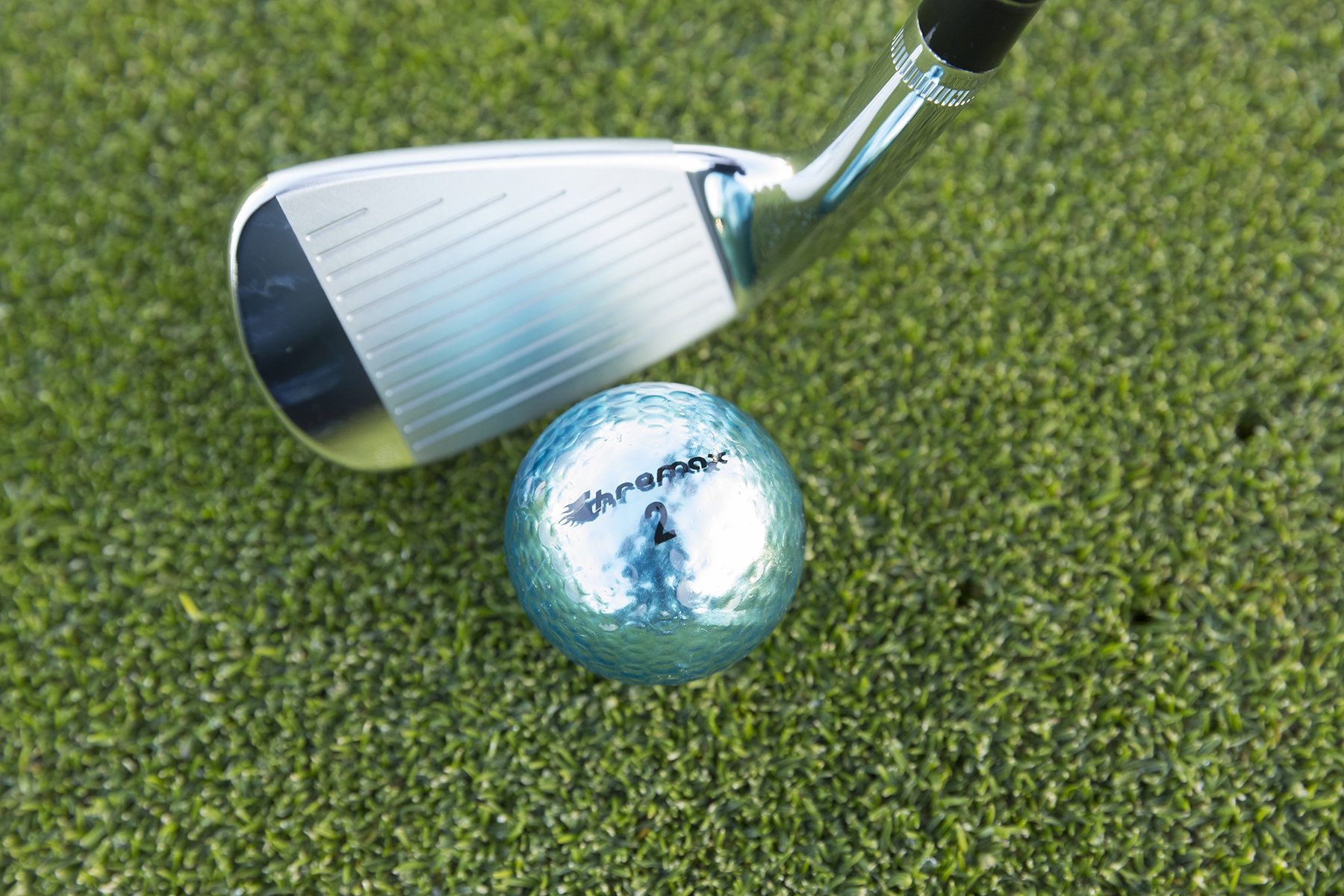 Chromax blue golf ball with wedge